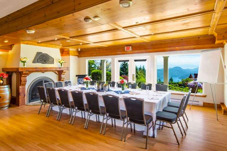 Set table in the Malahat Room with whiteboard setup.
