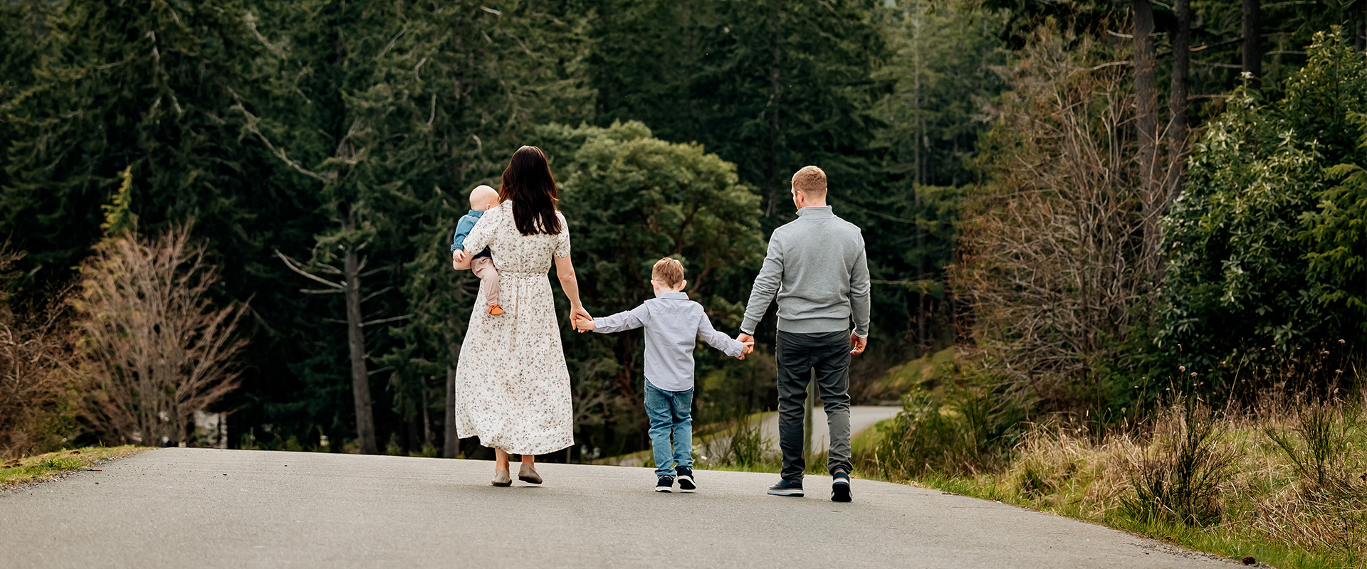 Family walking with children down the main road from the Villa Eyrie resort.