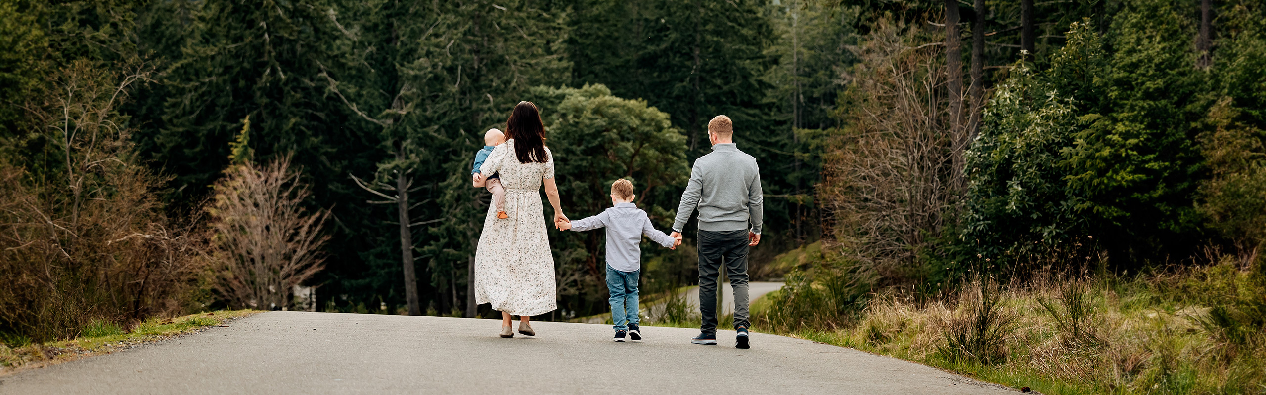 Family walking with children down the main road from the Villa Eyrie resort.