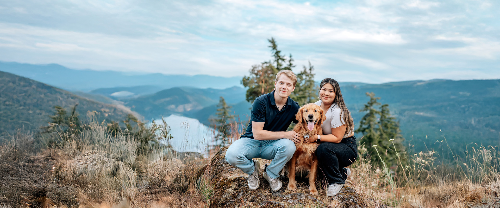 A happy dog with owner enjoying the scenic walking paths at Villa Eyrie Resort
