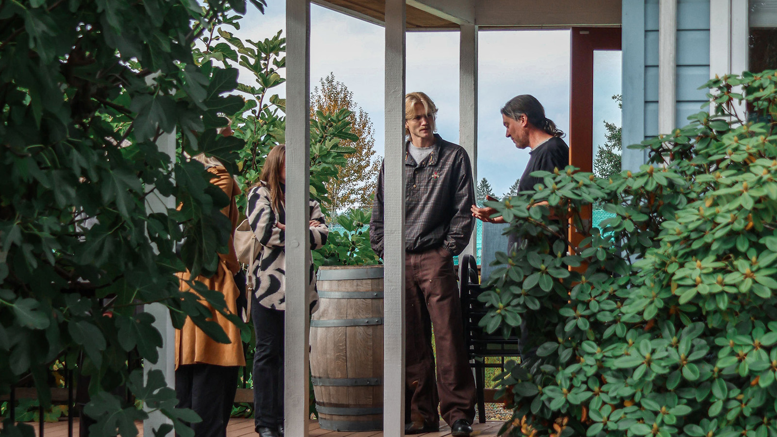 Group learning about wines at Alderlea Vineyards, part of the Winery Experience at Villa Eyrie Resort.
